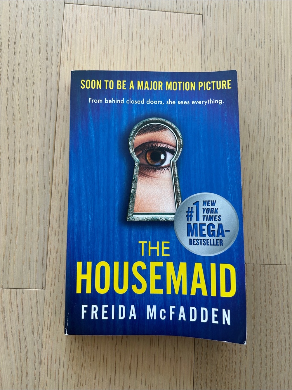 The Housemaid by Freida McFadden - Blue & Yellow Paperback